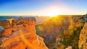 Breathtaking view of the Grand Canyon at sunrise, showcasing vibrant rock formations, holiday packages to los angeles, las vegas and grand canyon