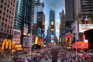 Times Square at night , a lively hub of New York City, a must-visit destination on your Washington to new york city tour packages
