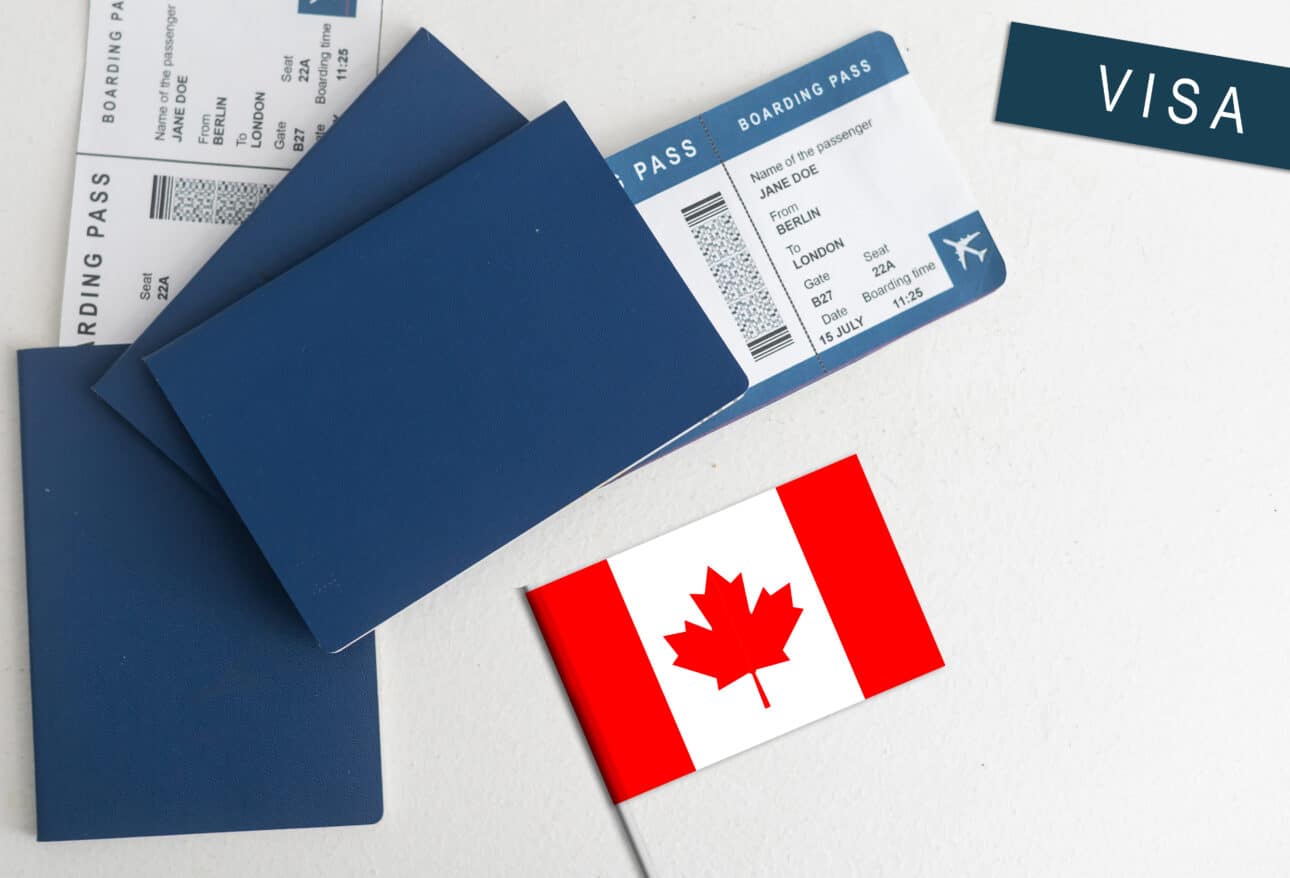 Apply canada travel visa application – Canadian flag with passports and boarding passes, symbolizing international travel and visa application process.